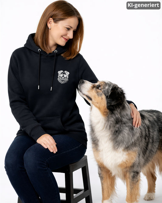 KI-generiertes Modelbild: Frau trägt schwarzen Hoodie mit Australian-Shepherd-Brustmotiv mit Sonnenbrille neben einem Australian Shepherd.